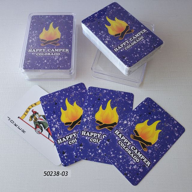 50238-03 Colorado Playing cards in clear plastic box. Deck has a campfire on a blue speckle background and says Happy Camper Colorado. 