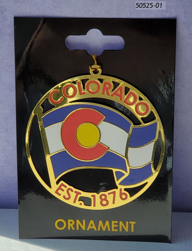 50520-01 Colorado Souvenir metal ornament, Gold color disk with cutout flag design with colored enamel. Hangs on a black card for putting on display. 